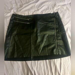 Never worn black short leather Torrid skirt. The skirt is a size 3 in torrid